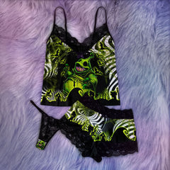 Wonder Skull Women's Lace Pajama Set is expertly designed to conform to your body's shape, providing a flawless fit with every wear. Crafted with stretchy and flattering materials, it embraces all body types, ensuring a silhouette that looks great on anyone. Wake up feeling refreshed and self-assured in this standout 3-piece outfit, featuring the Nightmare Boo Unique Print that combines trendy colors with retro vibes for a unique addition to your sleepwear collection.