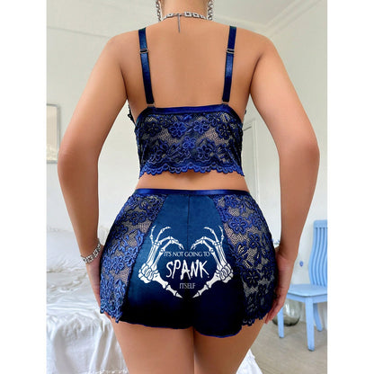 Wonder Skull Women's Lace Pajama Set in Naughty Blue Floral, featuring playful phrases and delicate lace for special occasions. Perfect for adding luxury to your sleepwear collection.