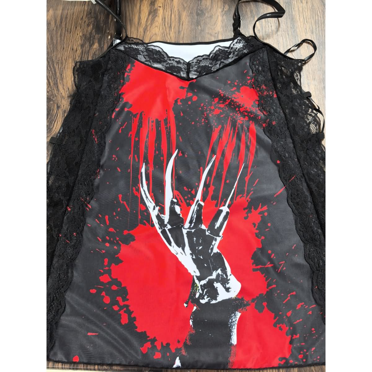 Wonder Skull Women's Nightgown combines comfort, style, and spooky charm with silky fabric, soft lace, adjustable straps, and glow-in-the-dark accents. Perfect for lounging, sleepwear, or gifting, it's a must-have for fans of gothic fashion and special occasions like Halloween or anniversaries.