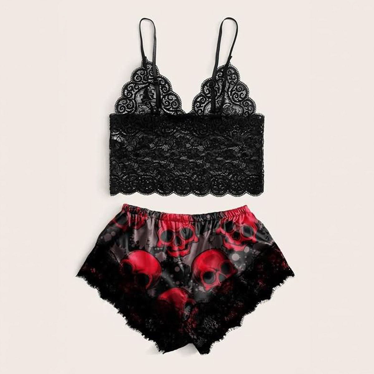 Wonder Skull sleepwear set combines comfort and bold style. The black floral lace trim on the cami and shorts feels soft on your skin, while lightweight, breathable fabric keeps you cool all night. Adjustable straps ensure a perfect fit, and the red skull print adds an edgy, confident touch.