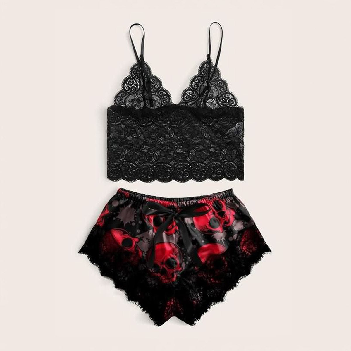 Wonder Skull sleepwear set combines comfort and bold style. The black floral lace trim on the cami and shorts feels soft on your skin, while lightweight, breathable fabric keeps you cool all night. Adjustable straps ensure a perfect fit, and the red skull print adds an edgy, confident touch.