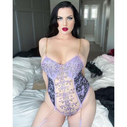Wonder Skull Women's Purple Lace Lingerie is a stylish one-piece bodysuit with a luxurious design, customizable fit, built-in bust support, and detachable garter straps. Perfect for adding elegance and confidence to your lingerie collection.
