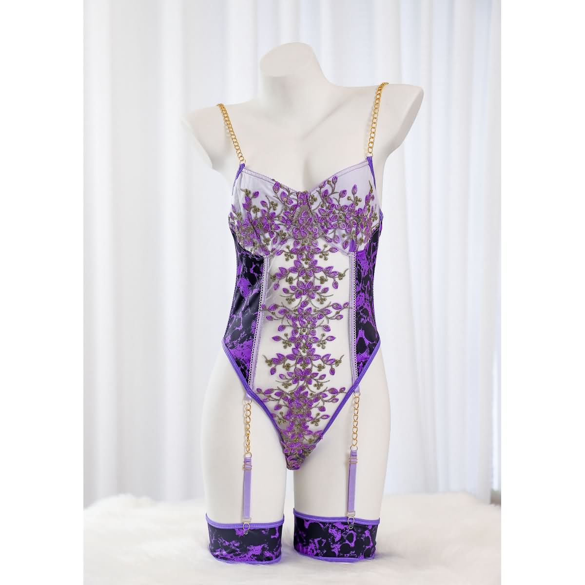 Wonder Skull Women's Purple Lace Lingerie is a stylish one-piece bodysuit with a luxurious design, customizable fit, built-in bust support, and detachable garter straps. Perfect for adding elegance and confidence to your lingerie collection.