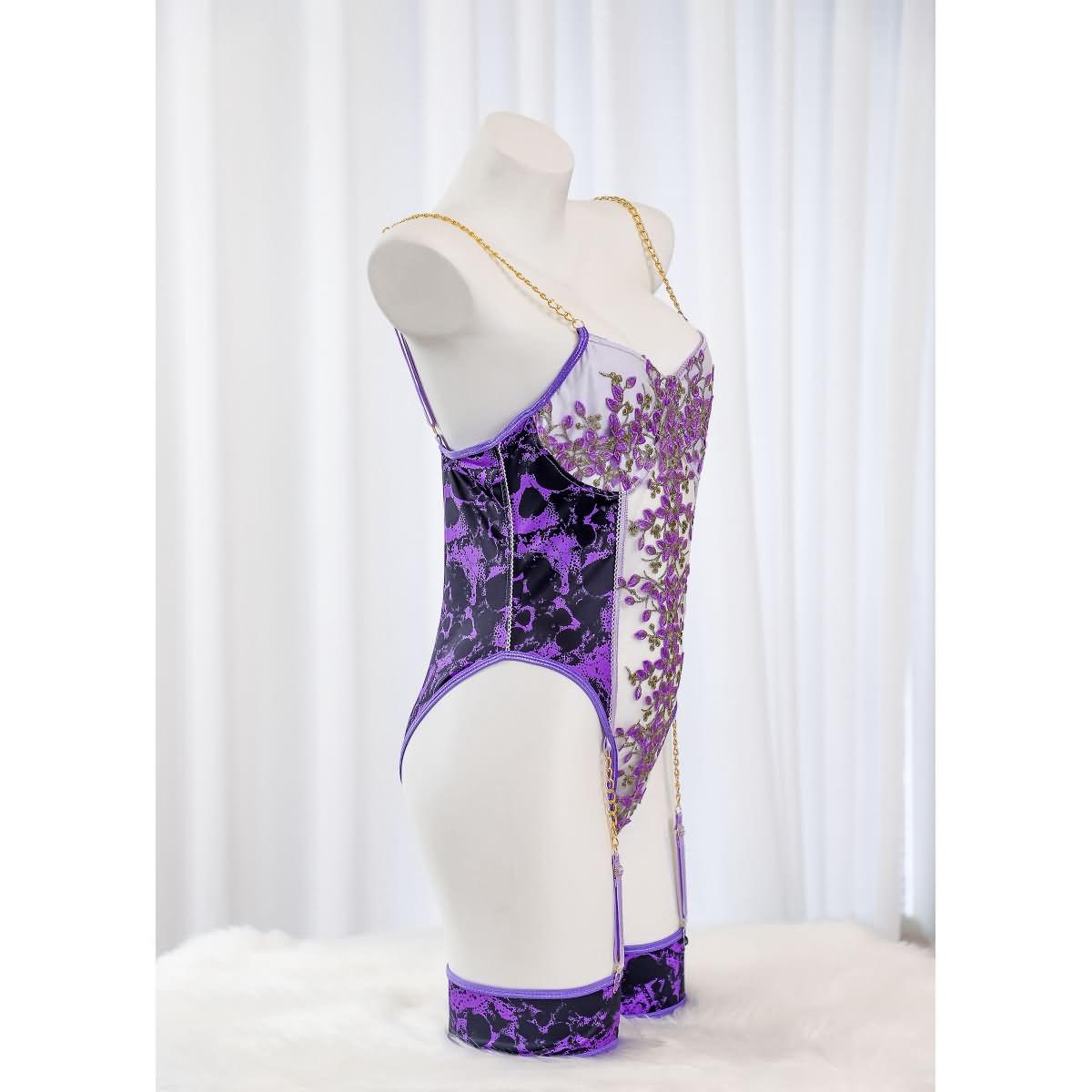 Wonder Skull Women's Purple Lace Lingerie is a stylish one-piece bodysuit with a luxurious design, customizable fit, built-in bust support, and detachable garter straps. Perfect for adding elegance and confidence to your lingerie collection.