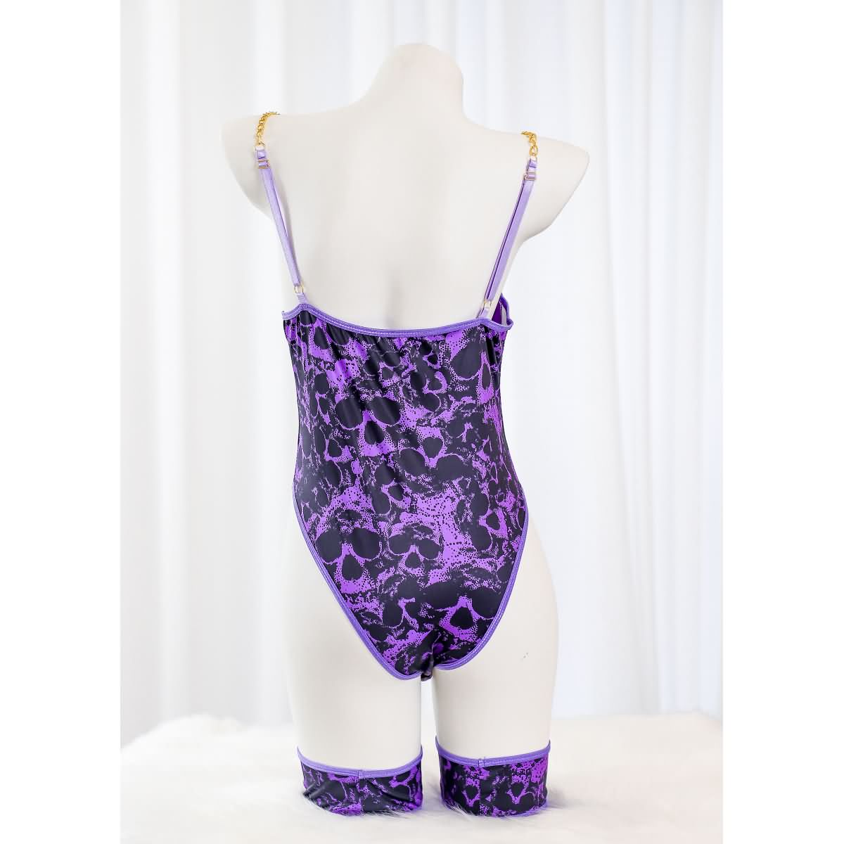 Wonder Skull Women's Purple Lace Lingerie is a stylish one-piece bodysuit with a luxurious design, customizable fit, built-in bust support, and detachable garter straps. Perfect for adding elegance and confidence to your lingerie collection.
