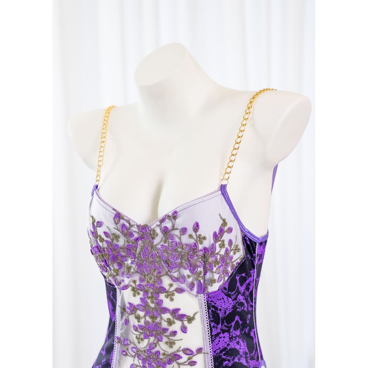 Wonder Skull Women's Purple Lace Lingerie is a stylish one-piece bodysuit with a luxurious design, customizable fit, built-in bust support, and detachable garter straps. Perfect for adding elegance and confidence to your lingerie collection.
