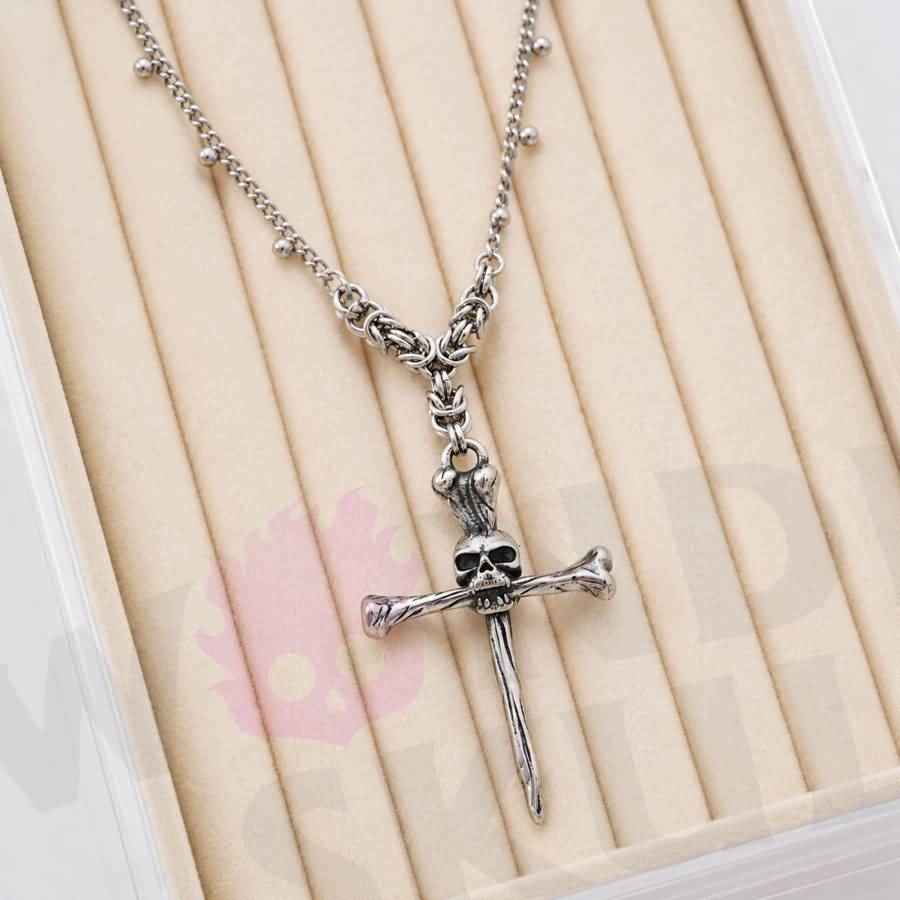 Wonder Skull gothic day collar features a bold skull-and-crossbones pendant on a delicate chain with sphere accents. With adjustable length options and a lobster clasp, it offers both style and practicality. Perfect for discreet D/s symbolism and alternative fashion, this silver-tone necklace is designed to sit close and make a statement.