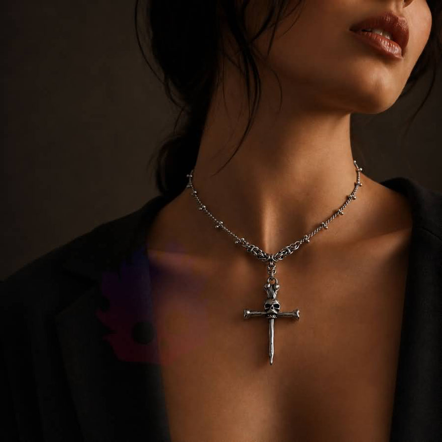 Wonder Skull gothic day collar features a bold skull-and-crossbones pendant on a delicate chain with sphere accents. With adjustable length options and a lobster clasp, it offers both style and practicality. Perfect for discreet D/s symbolism and alternative fashion, this silver-tone necklace is designed to sit close and make a statement.
