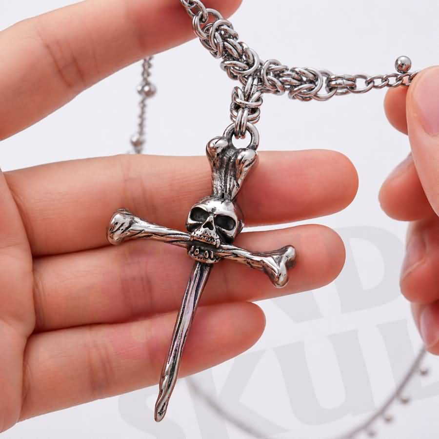 Wonder Skull gothic day collar features a bold skull-and-crossbones pendant on a delicate chain with sphere accents. With adjustable length options and a lobster clasp, it offers both style and practicality. Perfect for discreet D/s symbolism and alternative fashion, this silver-tone necklace is designed to sit close and make a statement.