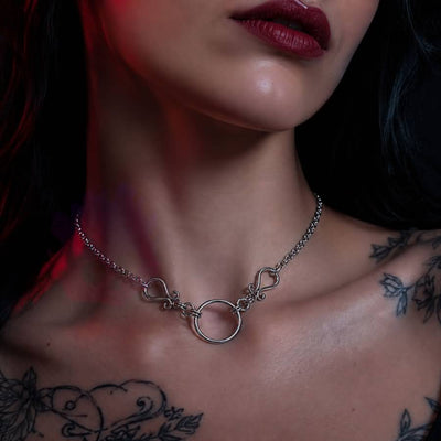 Wonder Skull Scrolled O-Ring Day Collar - Stainless Steel Sub Necklace

A quiet promise of devotion. A polished stainless steel chain connects to delicate filigree scrolls framing a 2 cm O-ring—a timeless symbol of connection.

Waterproof, tarnish-resistant, and built for 24/7 wear. Available in 16" or 18", it's discreet enough for daily wear, yet too meaningful to take off. Elegant to the world, unmistakable to the one who knows.