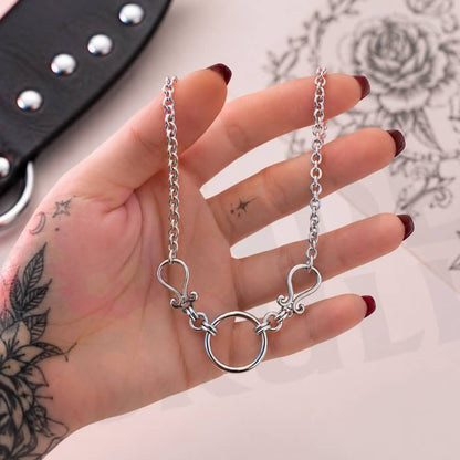 Wonder Skull Scrolled O-Ring Day Collar - Stainless Steel Sub Necklace

A quiet promise of devotion. A polished stainless steel chain connects to delicate filigree scrolls framing a 2 cm O-ring—a timeless symbol of connection.

Waterproof, tarnish-resistant, and built for 24/7 wear. Available in 16" or 18", it's discreet enough for daily wear, yet too meaningful to take off. Elegant to the world, unmistakable to the one who knows.