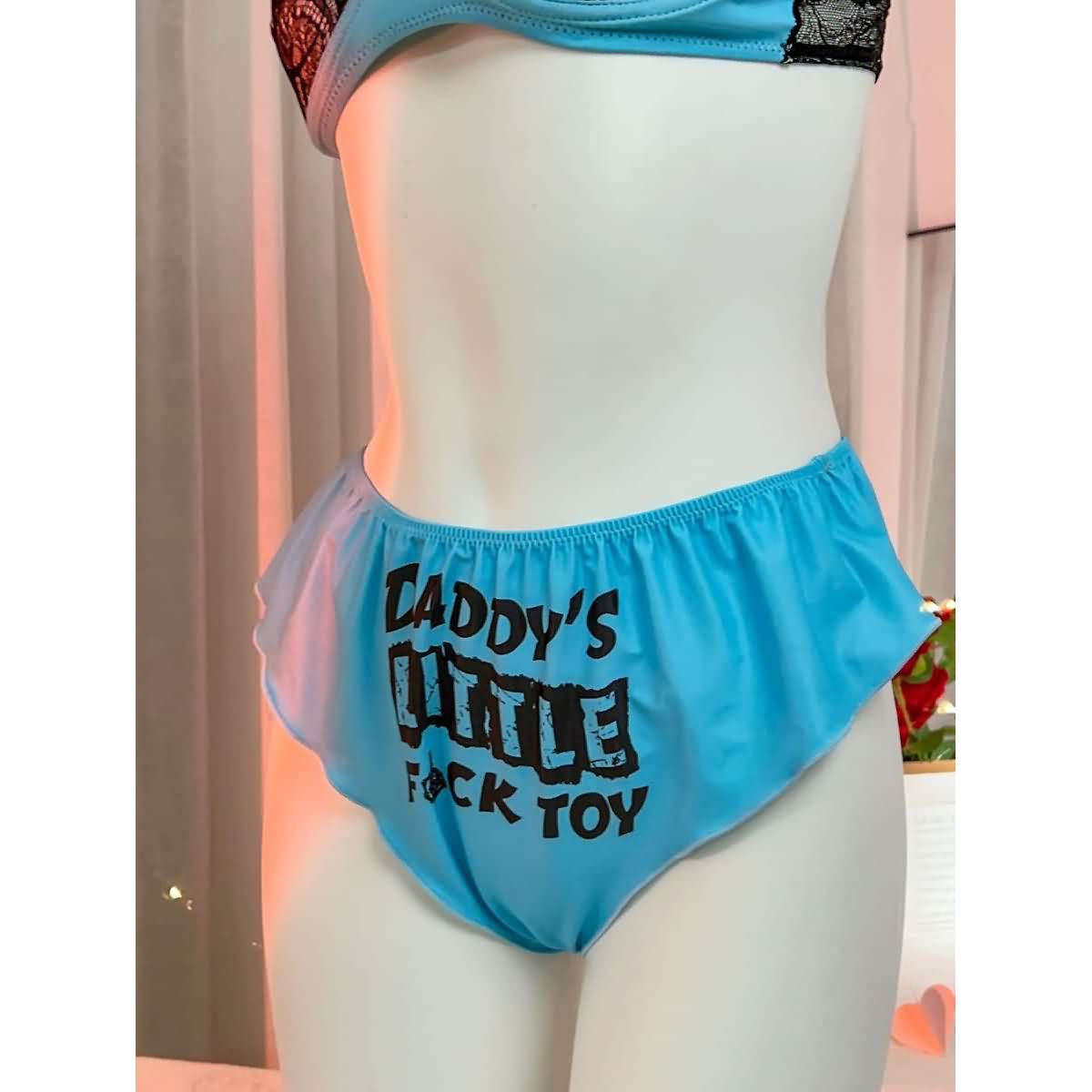 Wonder Skull's Contrast Lace Bra and Panty Set with a playful 'Daddy's Little F Toy' print for a bold and unique touch.