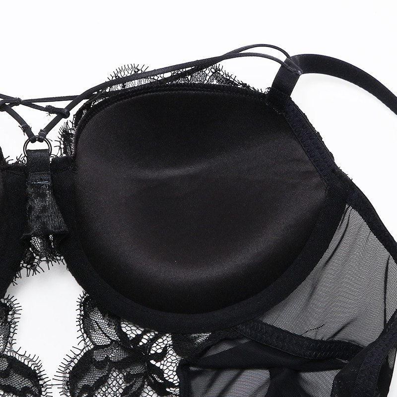 Welcome to the world of allure and elegance with the Nightmare Bandage Women's Bodysuit Sexy Hollow Lace Push Up. 