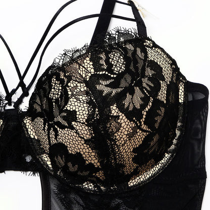 Welcome to the world of allure and elegance with the Nightmare Bandage Women's Bodysuit Sexy Hollow Lace Push Up. 