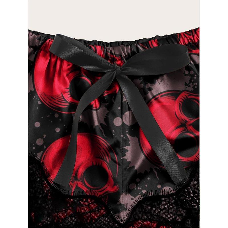 Wonder Skull Women's Pajama Set combines edgy punk style with comfort, featuring glow-in-the-dark skull designs and lace accents. Perfect for lounging or sleeping, it's ideal for fans of goth and punk-inspired fashion.